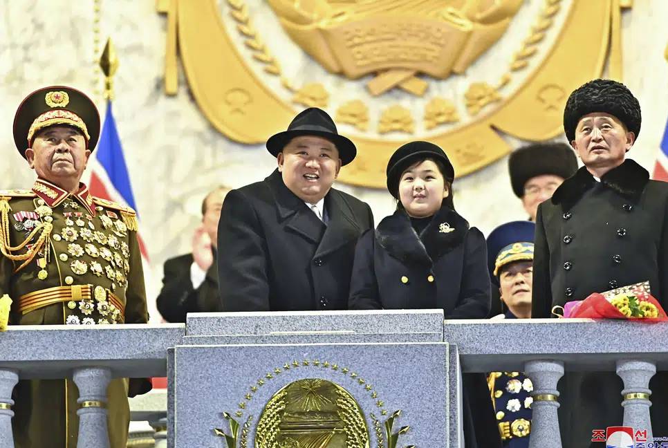 Kim Jong Un shows off daughter, missiles at parade