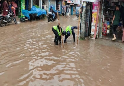 DNCC's Quick Response Team working to clear waterlogging caused by heavy rain