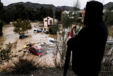 Flash floods sweep away cars, disrupt trains and leave several missing in Spain