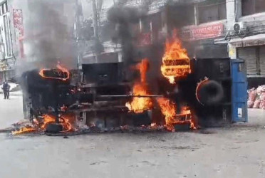 2 law enforcement vehicles burned as RMG workers clash with security forces