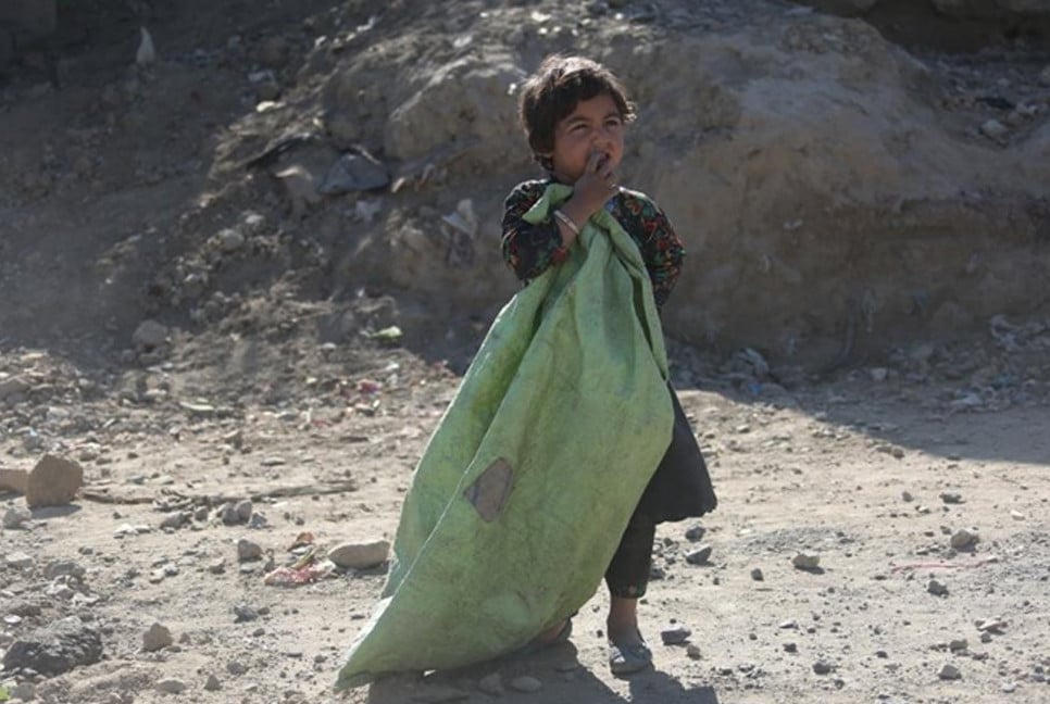 Afghan children struggle for a bite of bread as world celebrates Children's Day