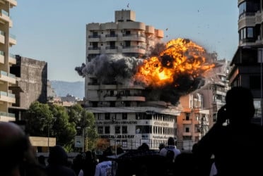 Israeli strikes kill a hospital director in Lebanon and wound 9 medics in Gaza