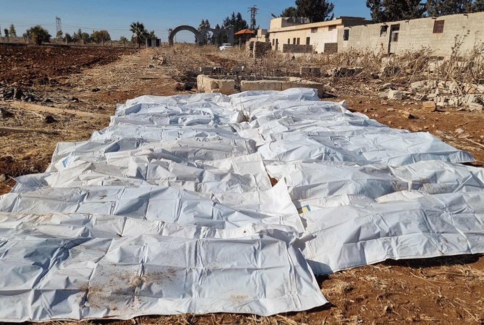 At least 100,000 bodies in mass grave near Damascus