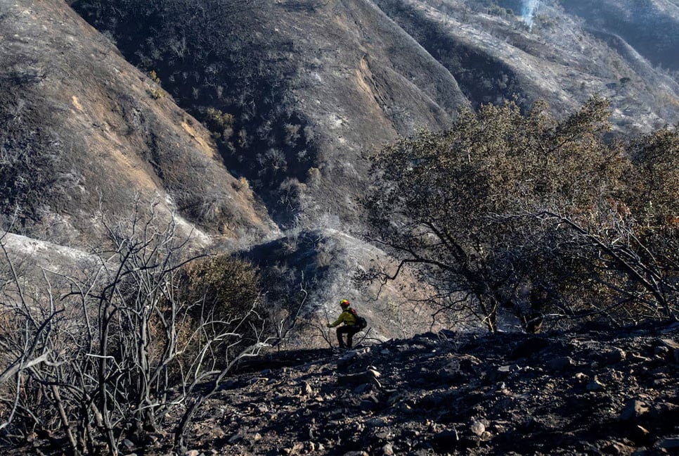 Los Angeles races to contain wildfires as severe winds appear