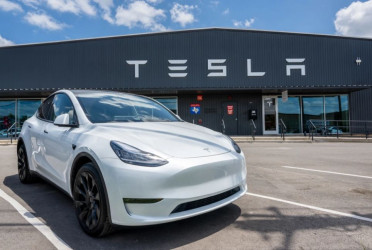 Tesla commits to cheaper cars in first half