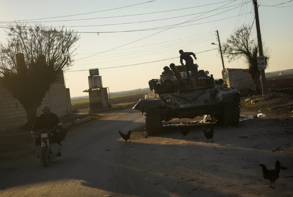 Syrians returning to the ruined town of Tel Rifaat