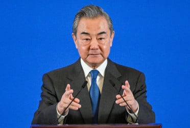 China will firmly counter US trade pressure: Wang Yi