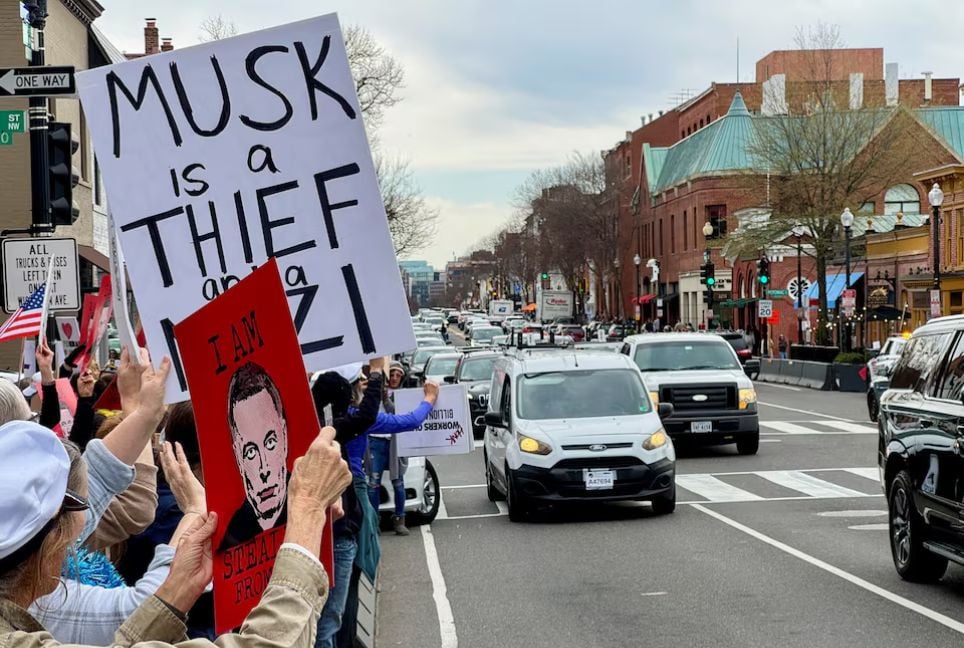 Anti-Musk protesters rally outside Tesla dealership in Washington