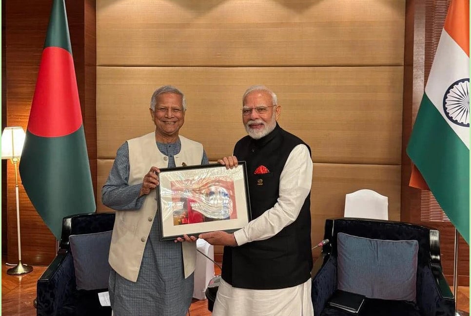 Prof. Yunus presents photograph to Modi