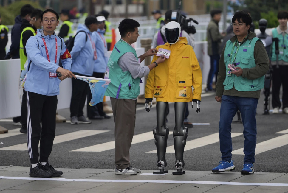 Humanoid robots run a Chinese half-marathon alongside human competitors