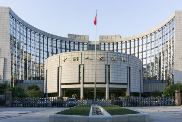 China's central bank cuts two key rates to historic lows