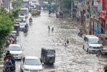 Dhaka commuters hit by morning downpour