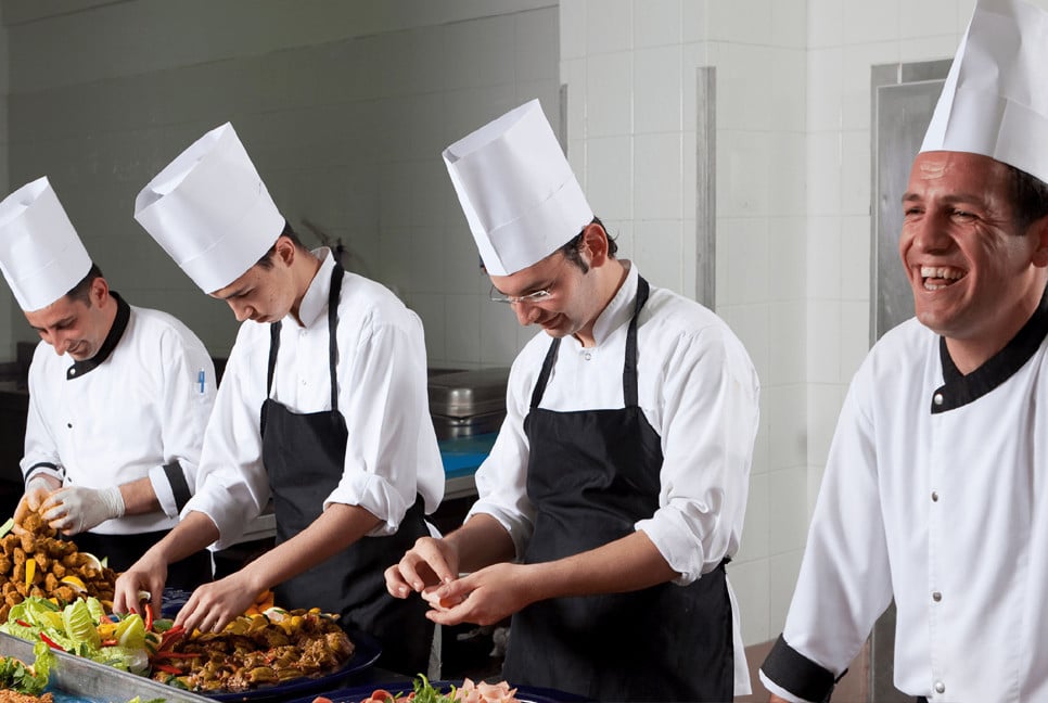 Why do chefs wear tall white hats?
