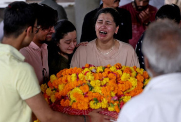 Relatives wait for remains after Air India crash