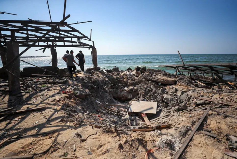 Israel bombs Gaza cafe, school and aid hubs, killing 95 Palestinians