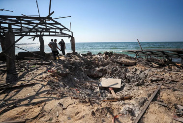 Israel bombs Gaza cafe, school and aid hubs, killing 95 Palestinians