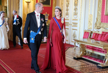 Kate Middleton wows in red cape gown by her wedding designer