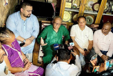 Tarique stands beside cancer-stricken mother of Ritu Porna Chakma