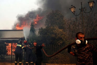 Greece battles wildfires, evacuating residents near Athens