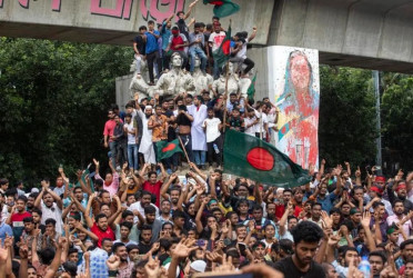 Interim govt to unveil democratic overhauls on revolution anniversary