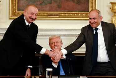 Armenia and Azerbaijan leaders shake hands, ink peace deal