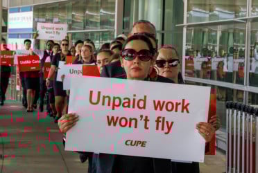 Air Canada pay talks intensify as cabin crew protest, threaten strike