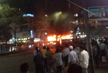Bus torched near Labaid Hospital in Dhanmondi