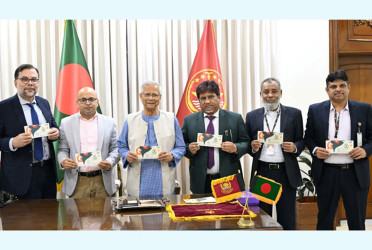 Prof Yunus unveils Victory Day stamp