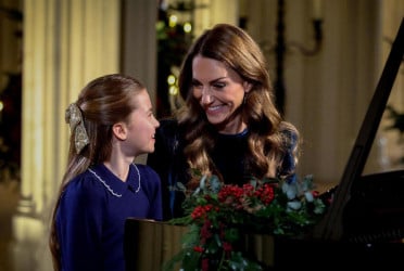 Catherine and daughter perform piano duet for Christmas carol concert
