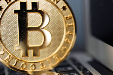 Bitcoin tests $60,000 as investors flee risky assets