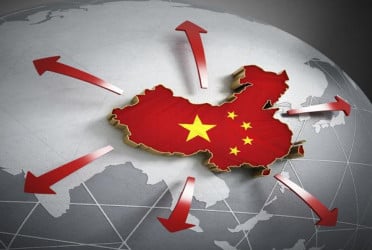 China's economy revs up despite war as growth tops forecasts