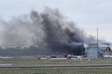 Small plane crashes into hangar at Parafield Airport of Australia, sparks fire