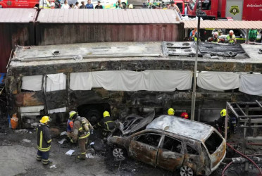 At least 8 killed as freight train crashes into bus in Bangkok