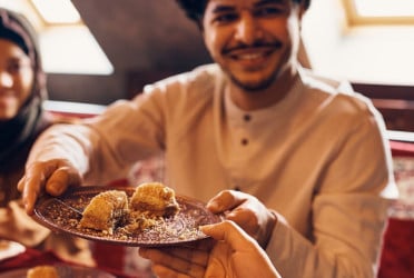 How should we eat during Eid al-Adha?