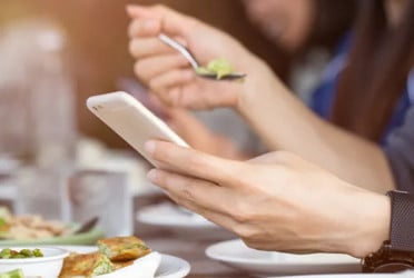 Parents use devices at dinner more than children