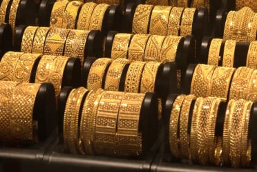 Gold price drops by Tk 3,266 per bhori